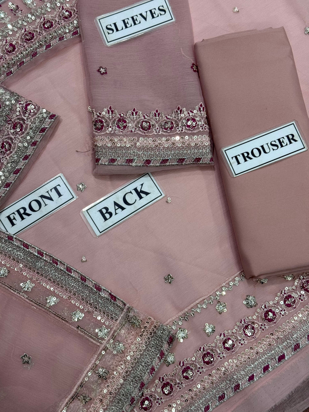 Shop the Asim Jofa replica chiffon suit with sequence work and soft Malai trouser. Order now from IZ Pattern and Place.