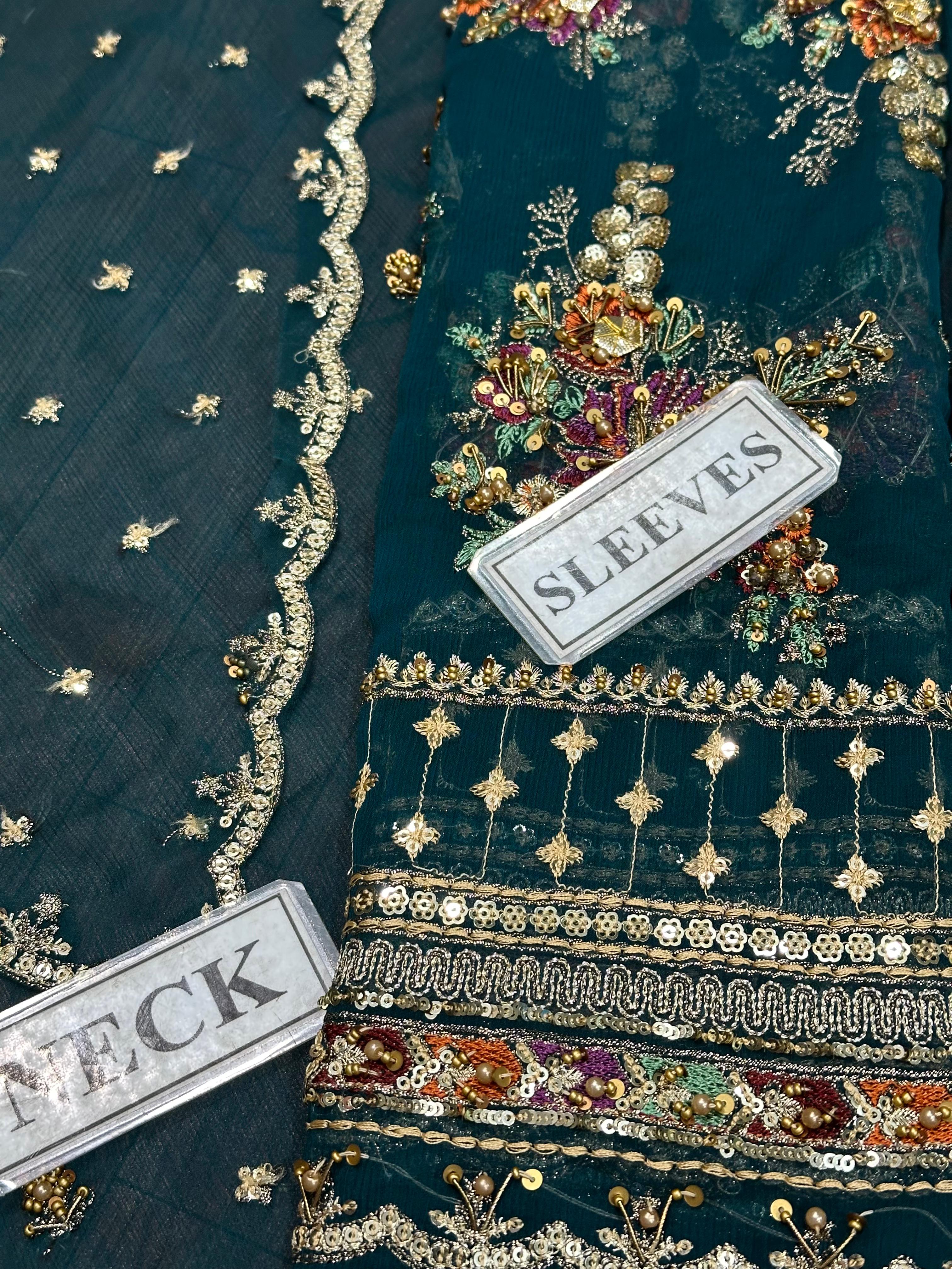Shop the Charizma Royal Premium chiffon 3-piece unstitched suit with net dupatta, raw silk trouser, Adda work, and sequence embroidery. Order now from IZ Pattern and Place.