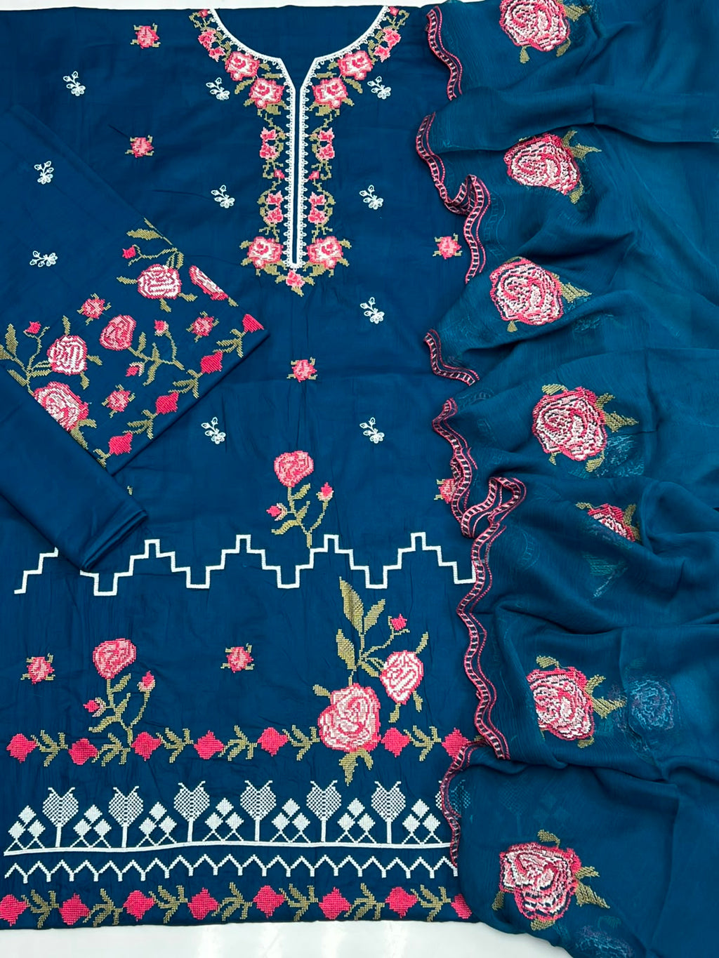 Shop the Cross Stitch Summer Collection 2026 lawn 3-piece suit with heavy embroidery and a ready-to-wear Bamber chiffon cutwork dupatta. Order now from IZ Pattern and Place.