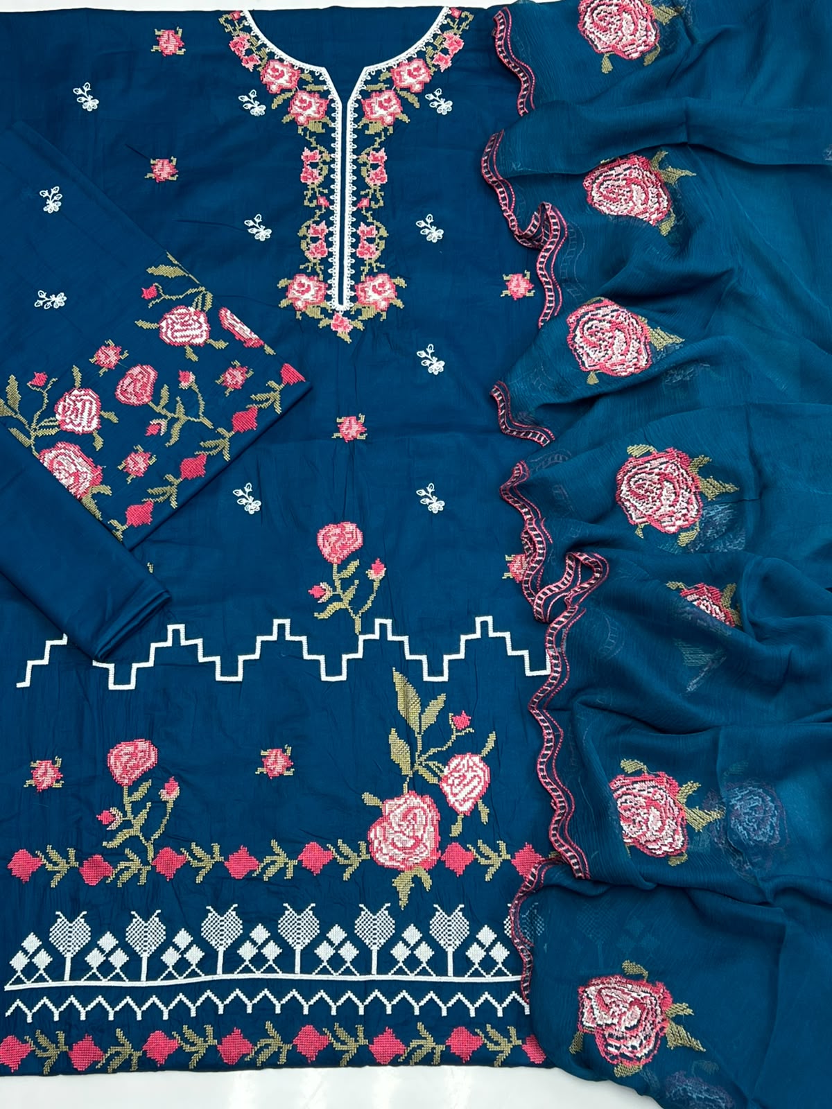 Shop the Cross Stitch Summer Collection 2026 lawn 3-piece suit with heavy embroidery and a ready-to-wear Bamber chiffon cutwork dupatta. Order now from IZ Pattern and Place.