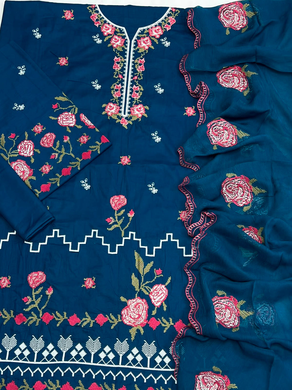 Shop the Cross Stitch Summer Collection 2026 lawn 3-piece suit with heavy embroidery and a ready-to-wear Bamber chiffon cutwork dupatta. Order now from IZ Pattern and Place.