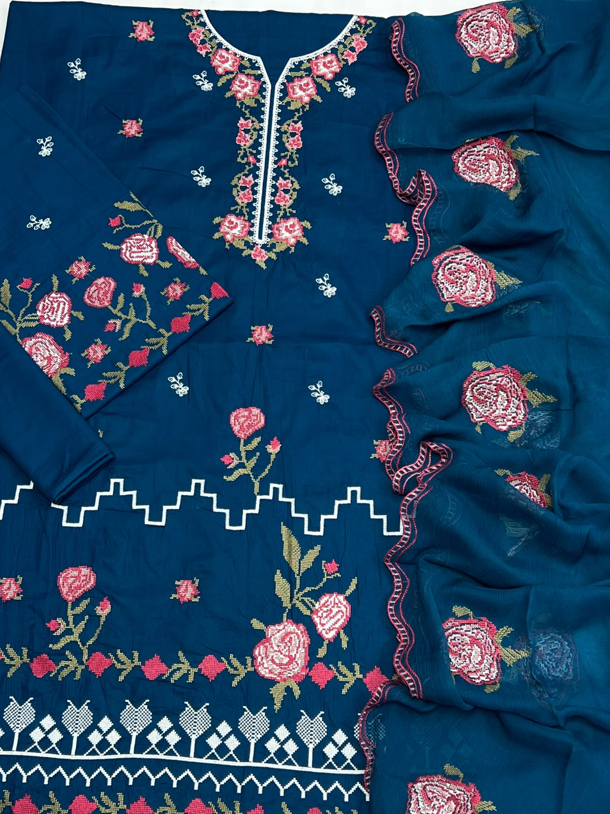 Shop the Cross Stitch Summer Collection 2026 lawn 3-piece suit with heavy embroidery and a ready-to-wear Bamber chiffon cutwork dupatta. Order now from IZ Pattern and Place.