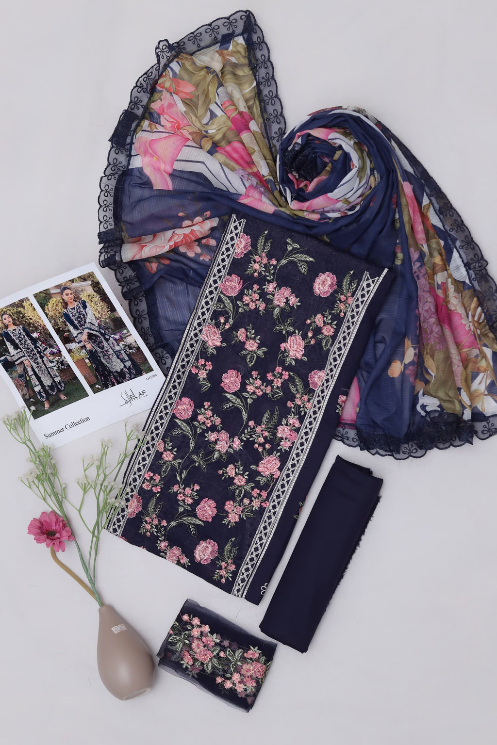 Shop the Maria B Jade luxury lawn 3-piece suit with heavy multi-head embroidery and a ready-to-wear digital print Swiss voile dupatta. Order now from IZ Pattern and Place.